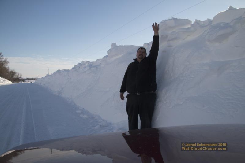 Standing near a snowdrift following a blizzard near Zumbrota, Minnesota.